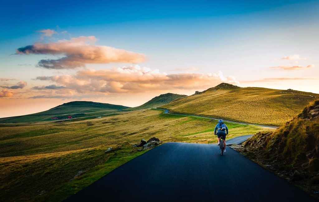 man cycling in the mountains