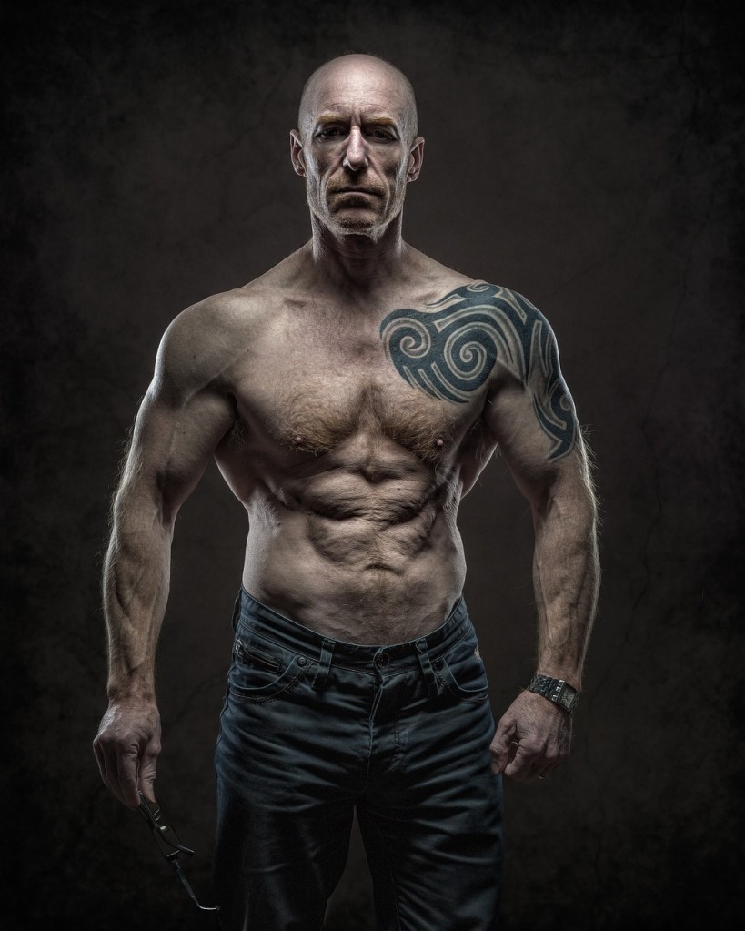 middle-aged man in great shape with ripped abs